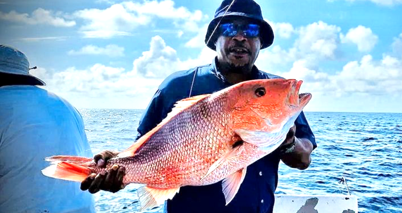 Red snapper fishing Panama City Beach – Reel Groovy charter guest with big catch