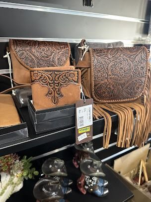 A Purse with Fringe and A Wallet Are on A Shelf in A Store — Country Charm in Charmhaven, NSW