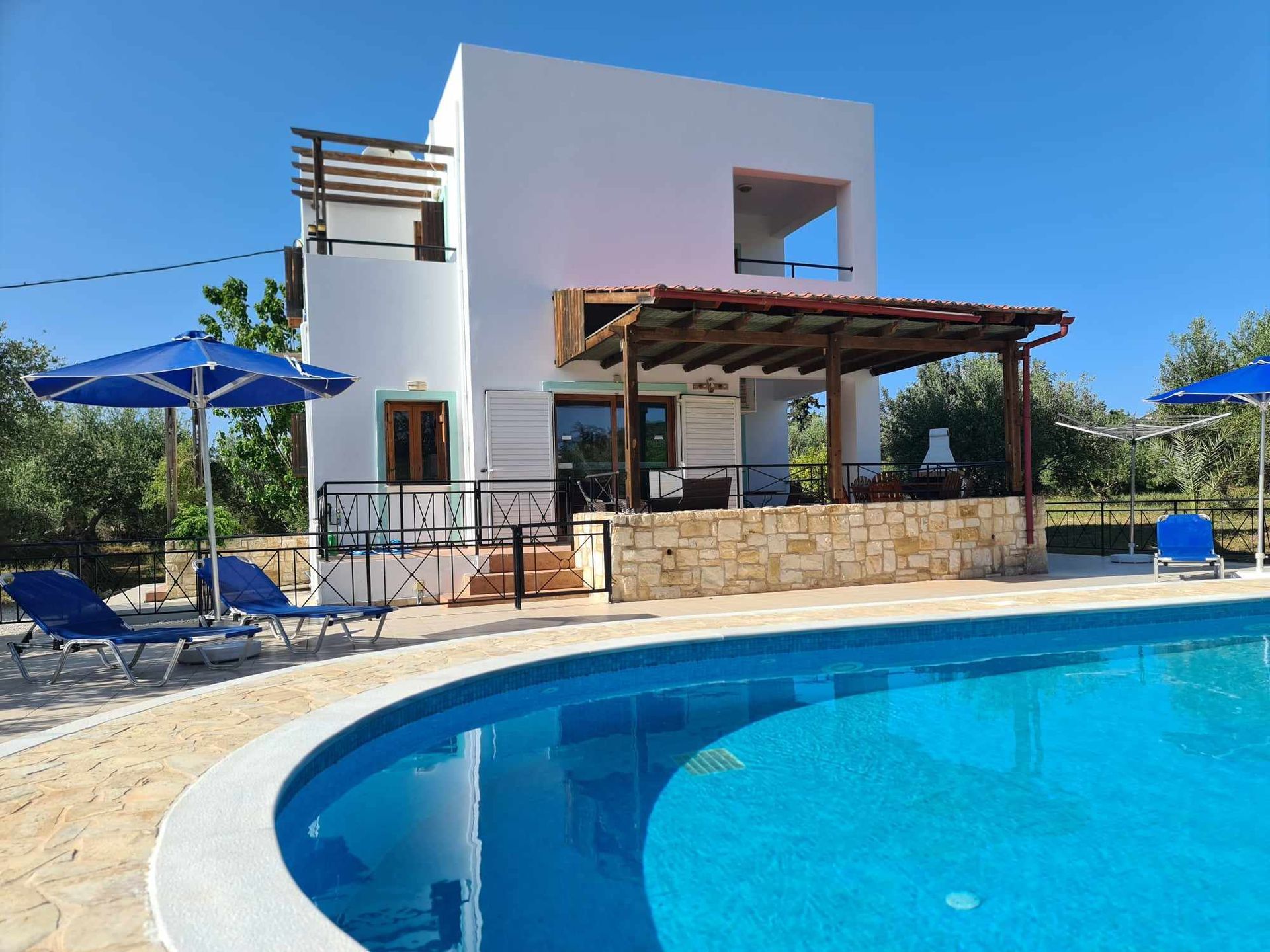 Poolside view of the child friendly Villa Angelos