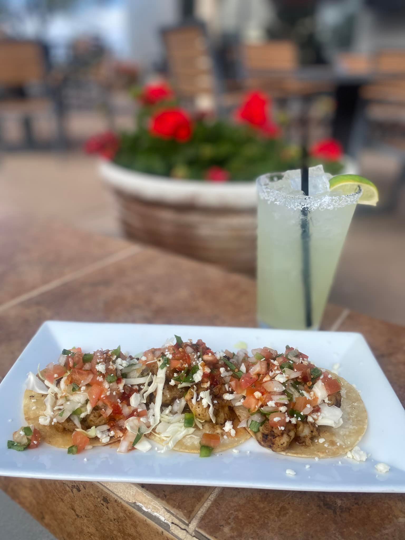 A plate of food and a drink on a table.