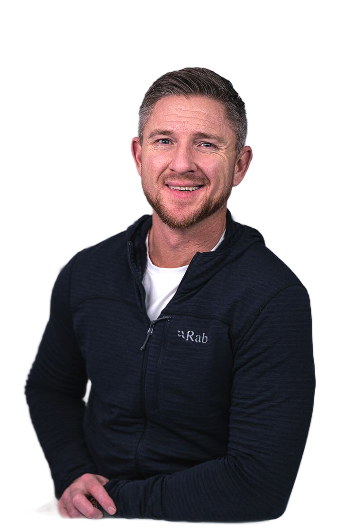 Man smiling, wearing a black hooded jacket. Text: Trent Grandstaff, Owner | REALTOR.