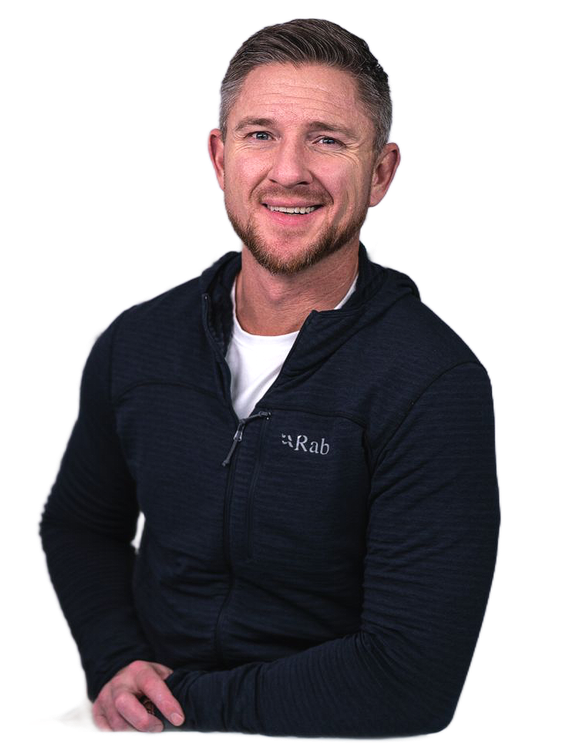 Man smiling, wearing a black hooded jacket. Text: Trent Grandstaff, Owner | REALTOR.