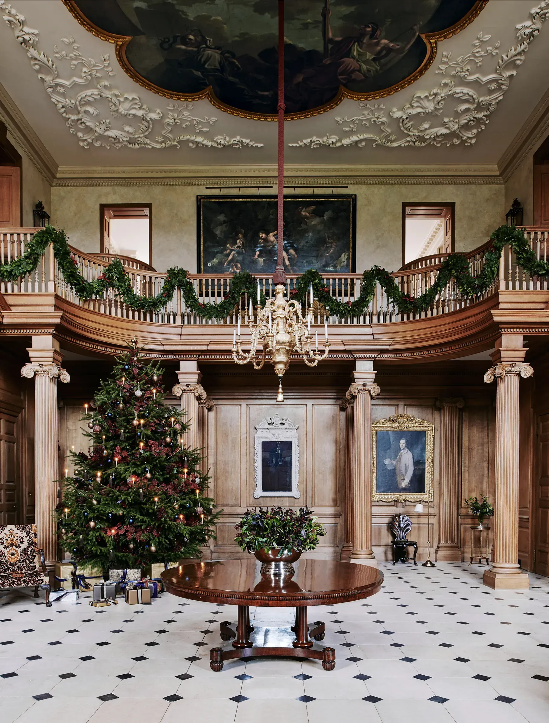 A large room with a christmas tree in the middle