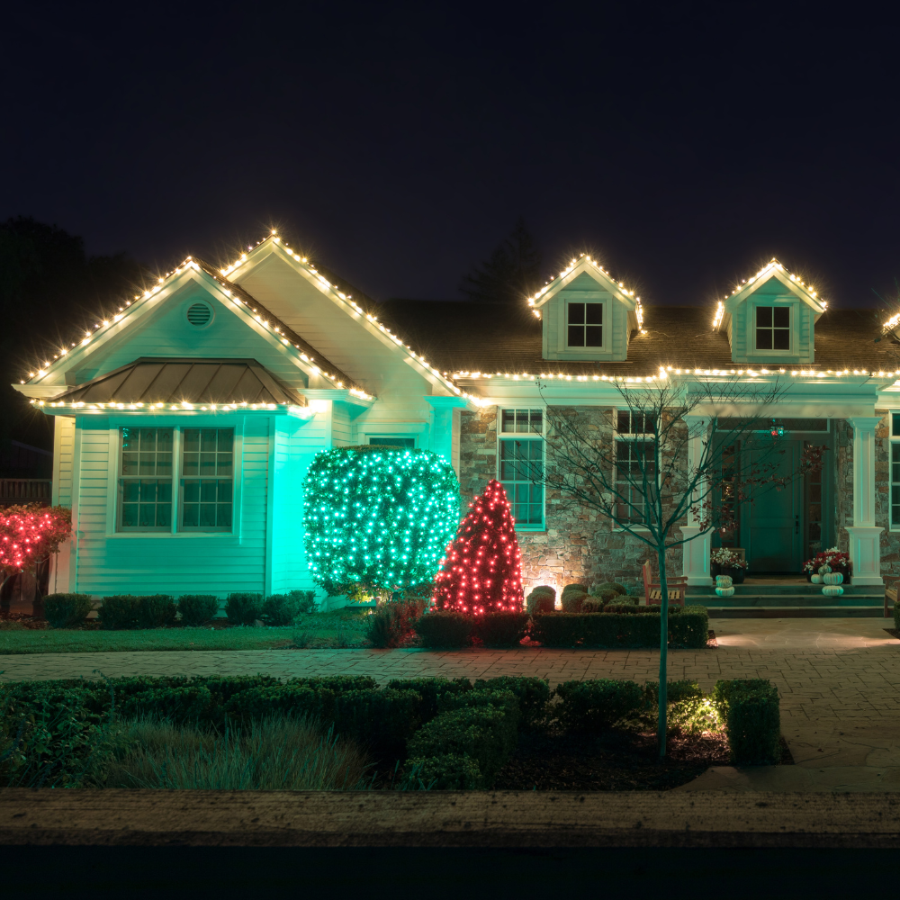 A house with christmas lights on it at night