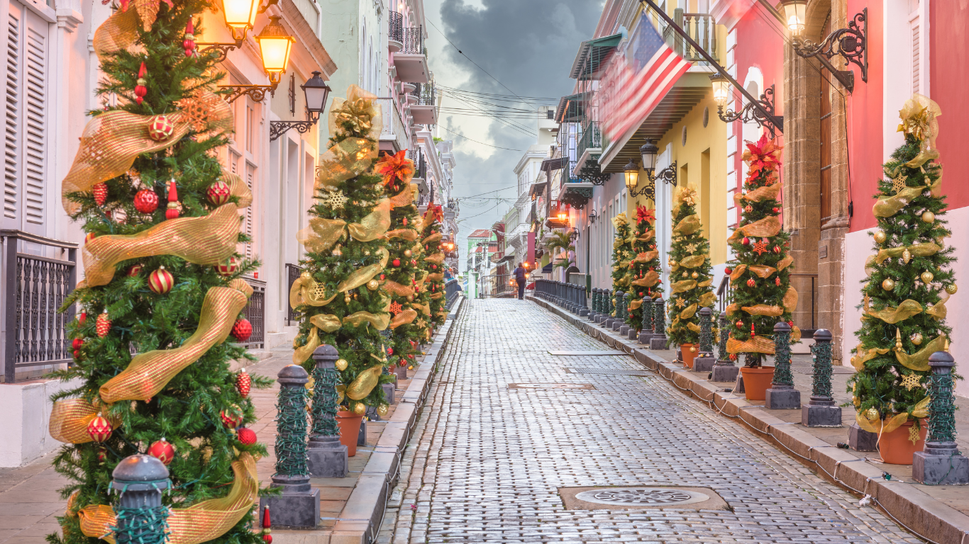 Cobblestone street lined with Christmas trees in Old San Juan, Puerto Rico.