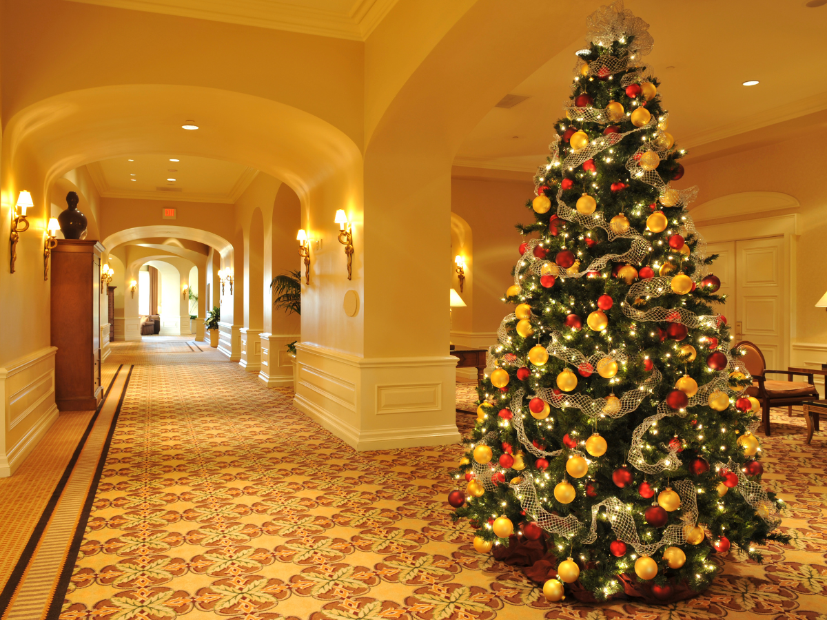 A hallway with a christmas tree in the middle A hallway with a christmas tree in the middle