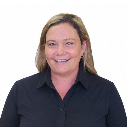A woman smiling wearing a check shirt