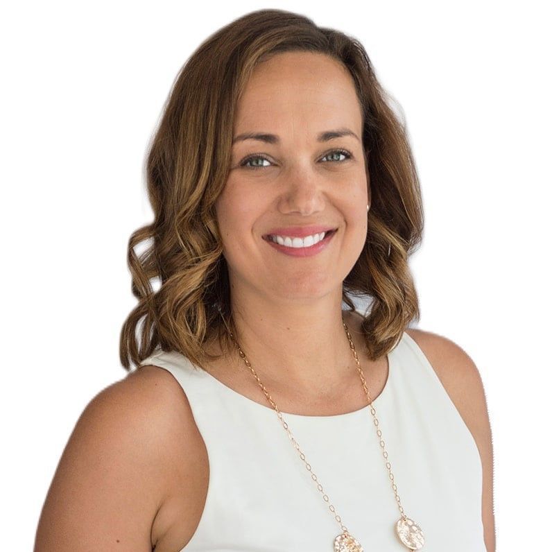 A woman smiling wearing a white shirt