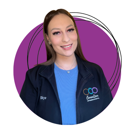 A woman in a blue shirt is smiling in a purple circle