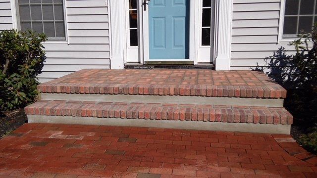 A Front Porch with Brick Steps and A Blue Door — Flemington, NJ — LaFerla Bros Inc.