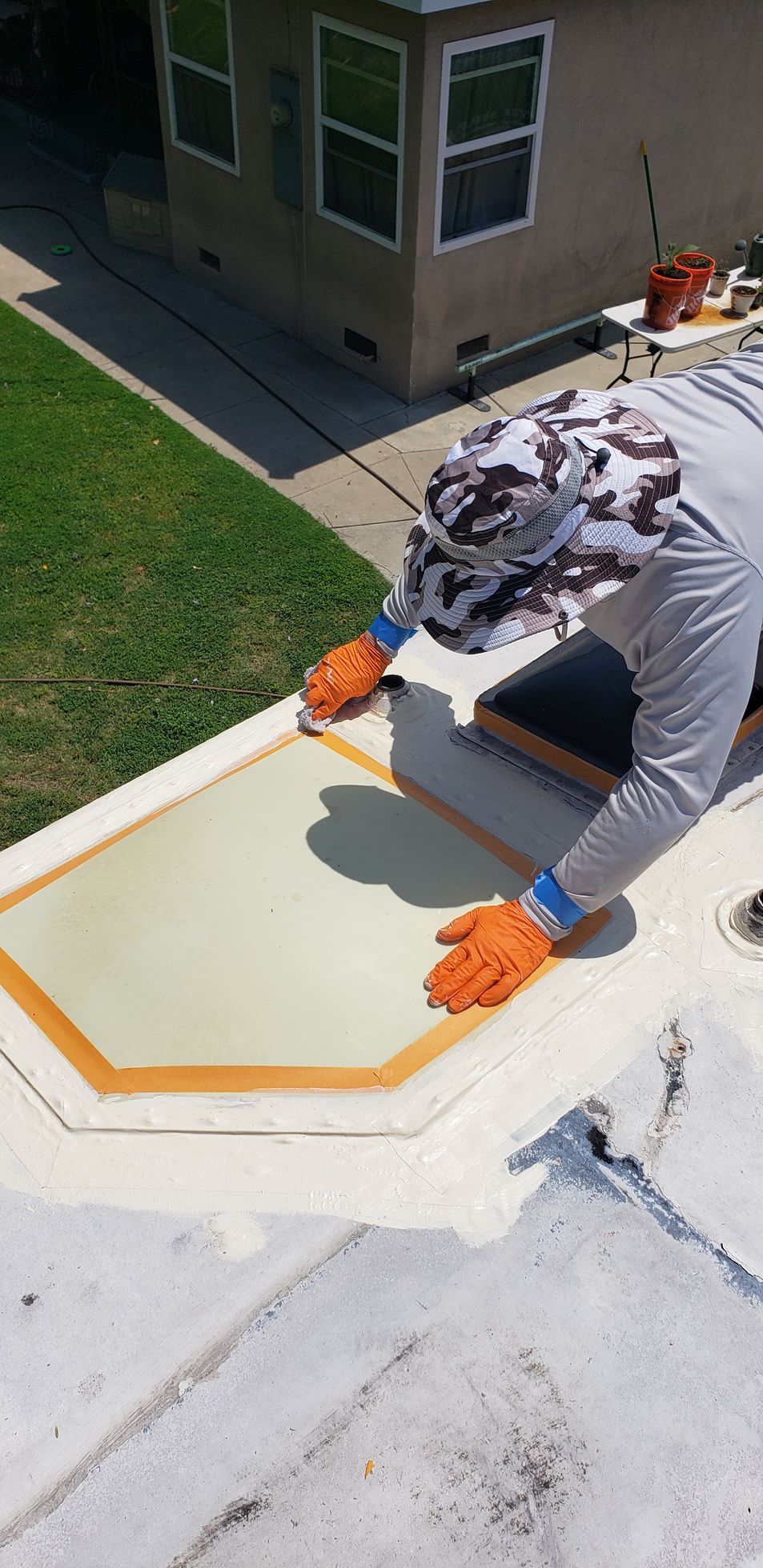 A man is working on an RV Roof for RV Roofing Solutions
