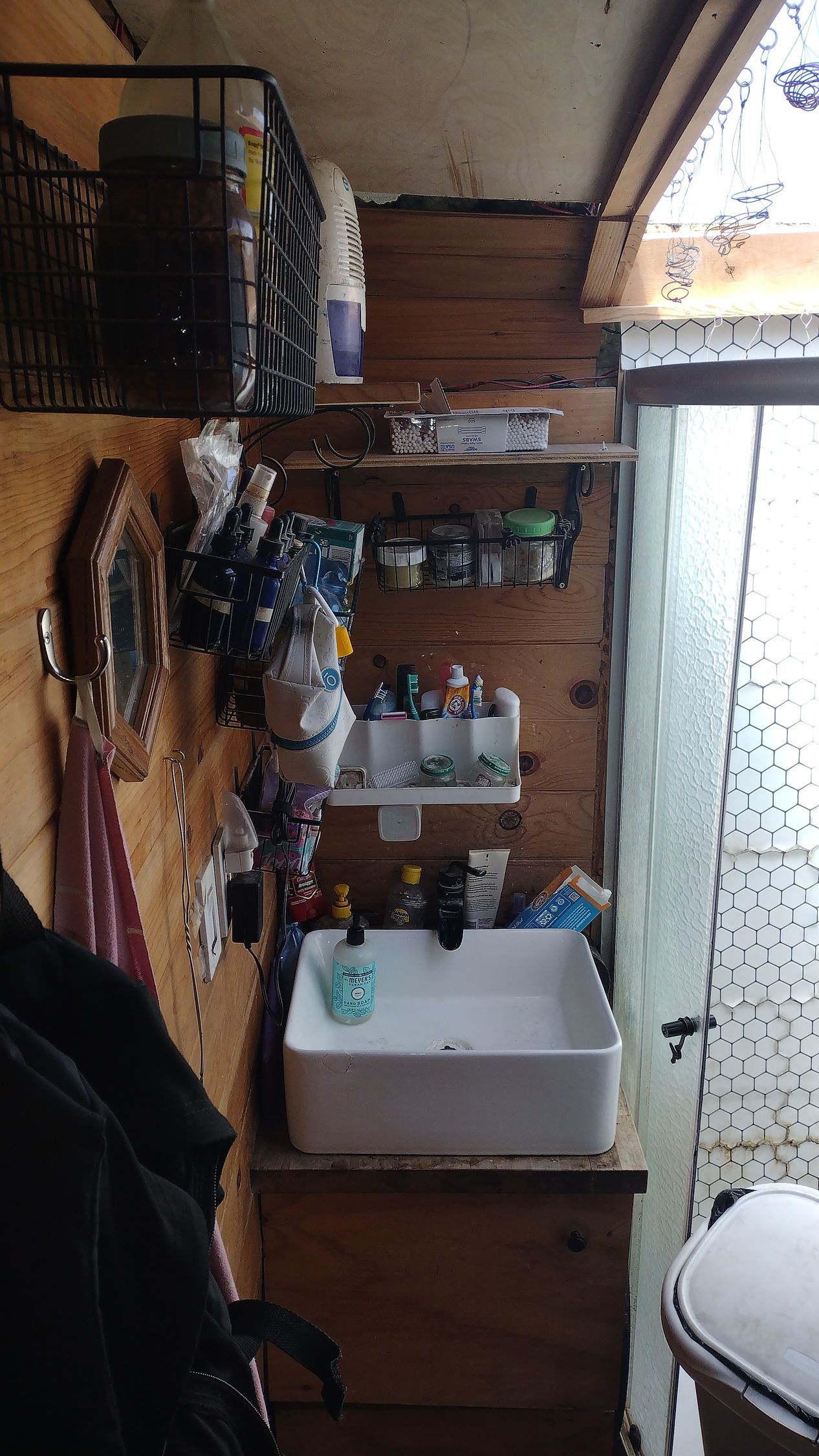 A bathroom with a sink and a mirror on the wall.