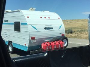 Gas cans mounted to back of a trailer