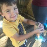 Holding a chick at the farm