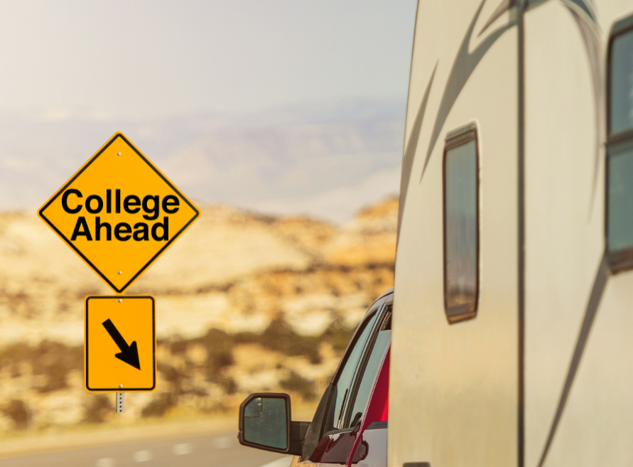 A yellow sign on the side of a road that says college ahead