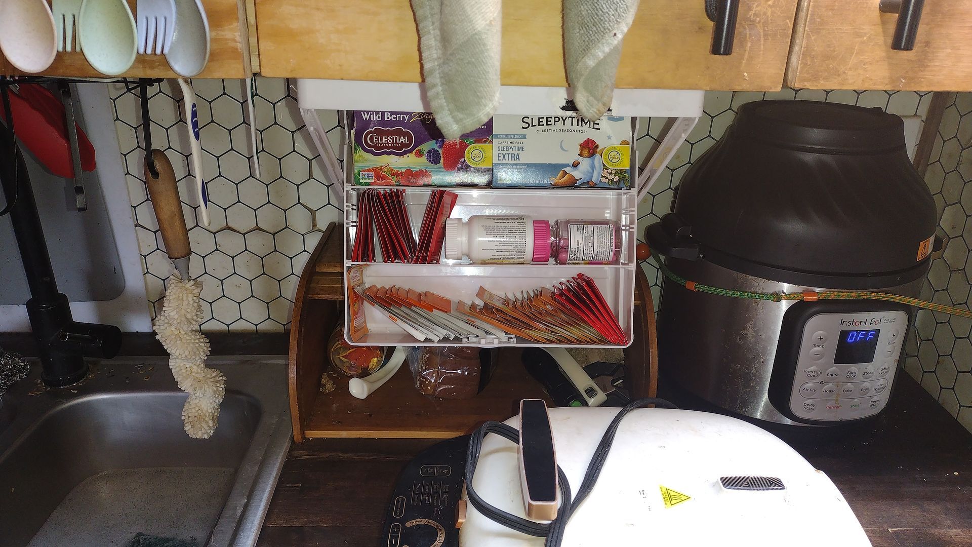 A kitchen counter with a few utensils on it