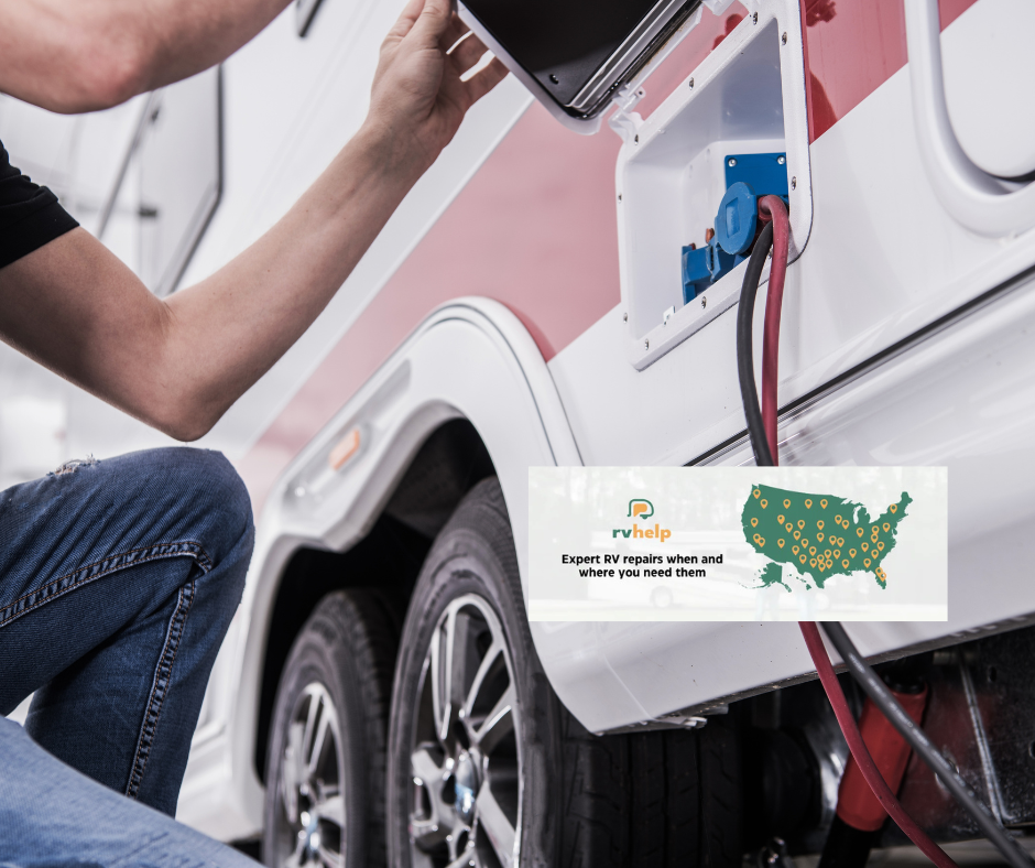 A man is kneeling down next to a rv that is being repaired.