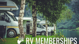A rv is parked in a grassy area next to a lake.
