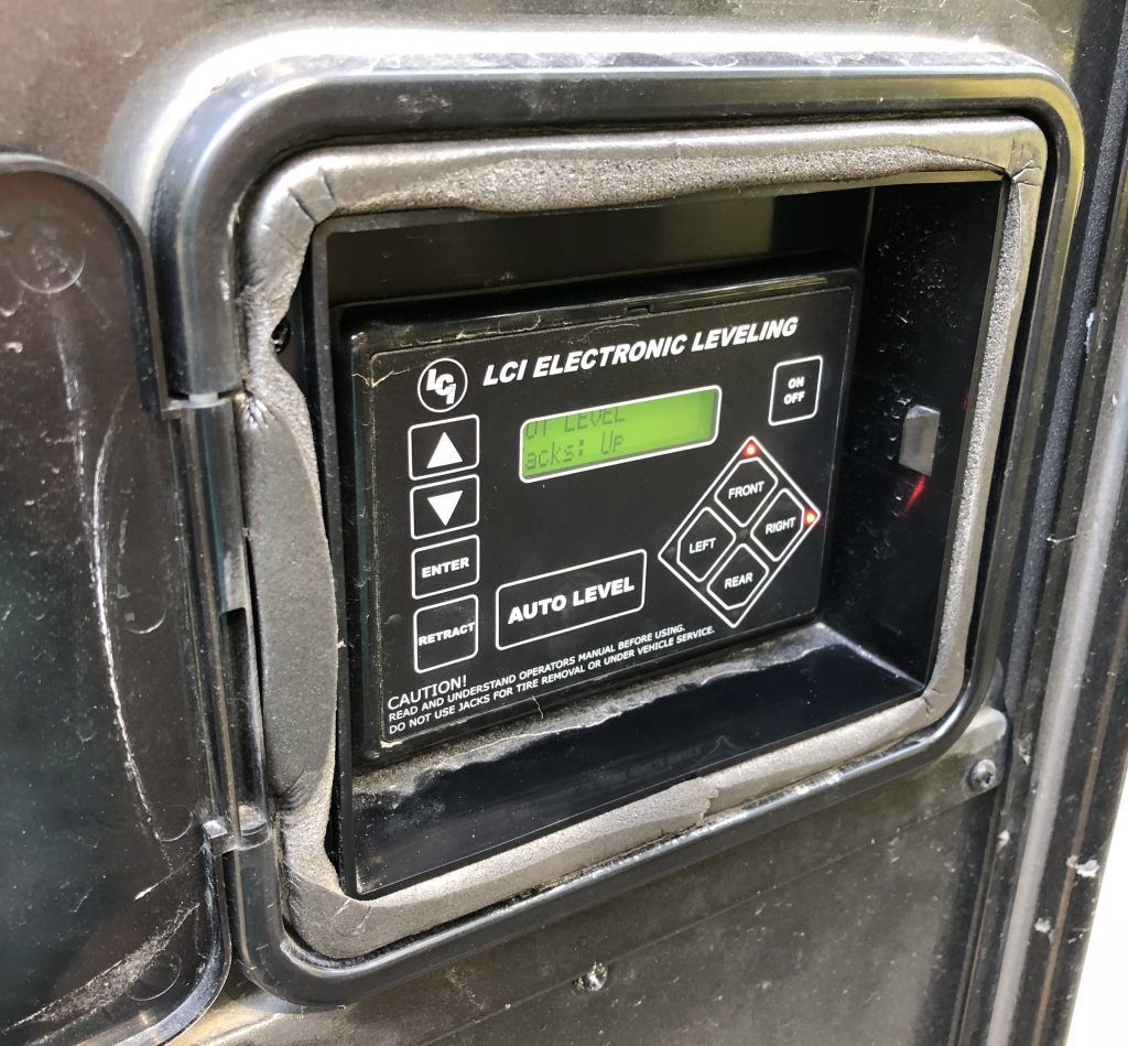 A black electronic device that says auto level on it