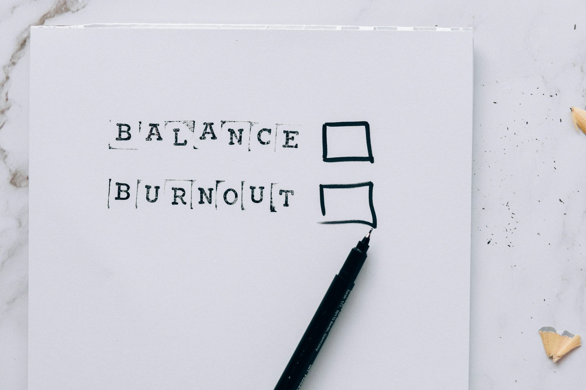 A piece of paper with the words balance burnout written on it