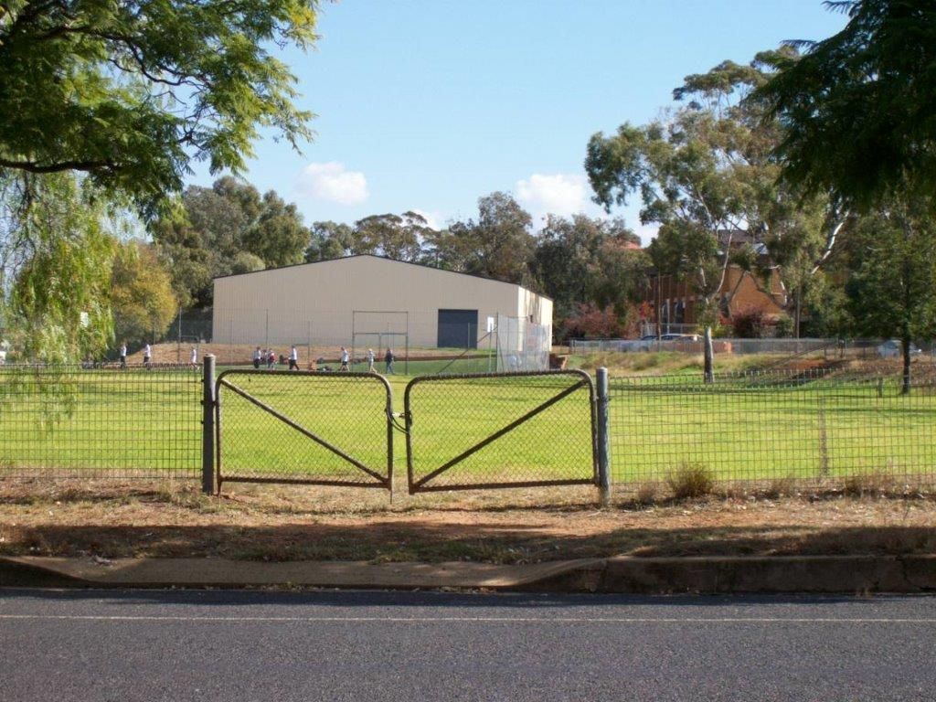 Black metal gate in front of a grassy lot — More Than Garages Pty Ltd–Ranbuild Tamworth in Taminda, NSW