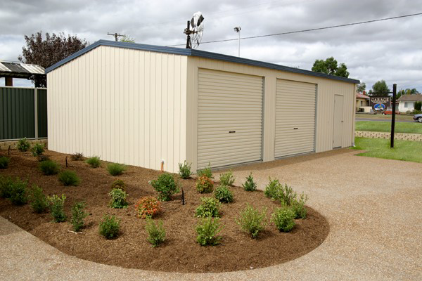 Beige metal storage building with roll-up doors — More Than Garages Pty Ltd–Ranbuild Tamworth in Taminda, NSW