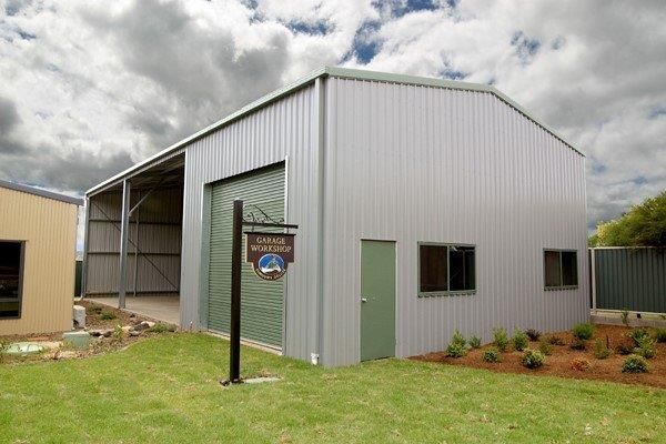 A Large Metal Structure With A Cloudy Sky In The Background  — More Than Garages Pty Ltd–Ranbuild Tamworth in Taminda, NSW