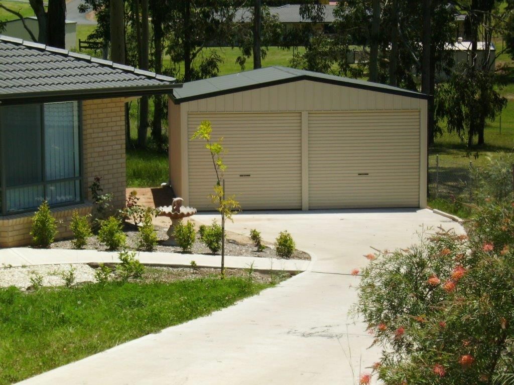 Beige double garage beside a house — More Than Garages Pty Ltd–Ranbuild Tamworth in Taminda, NSW