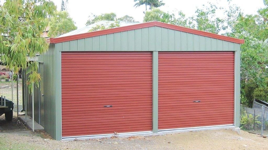Red double garage with corrugated metal doors and a green roof — More Than Garages Pty Ltd–Ranbuild Tamworth in Taminda, NSW