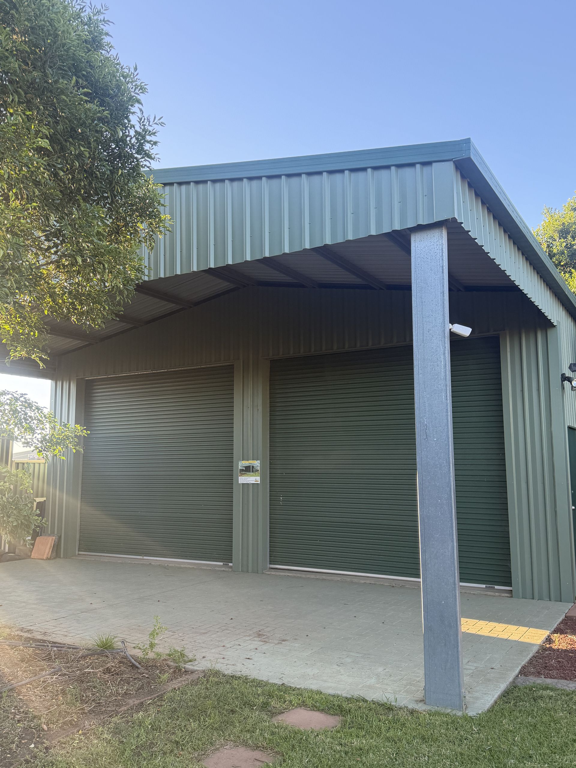 A Parking Lot With A Canopy Over It  — More Than Garages Pty Ltd–Ranbuild Tamworth in Taminda, NSW