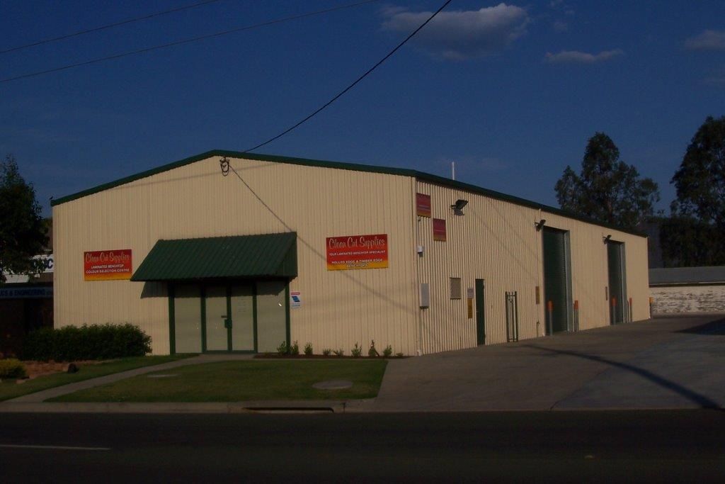 Beige industrial building with green awning — More Than Garages Pty Ltd–Ranbuild Tamworth in Taminda, NSW