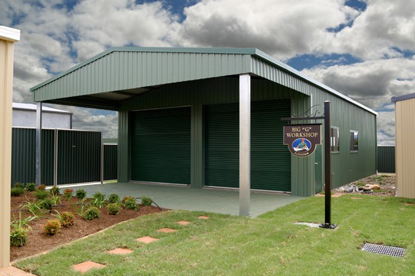 Green metal storage shed with a covered entrance and sign — More Than Garages Pty Ltd–Ranbuild Tamworth in Taminda, NSW