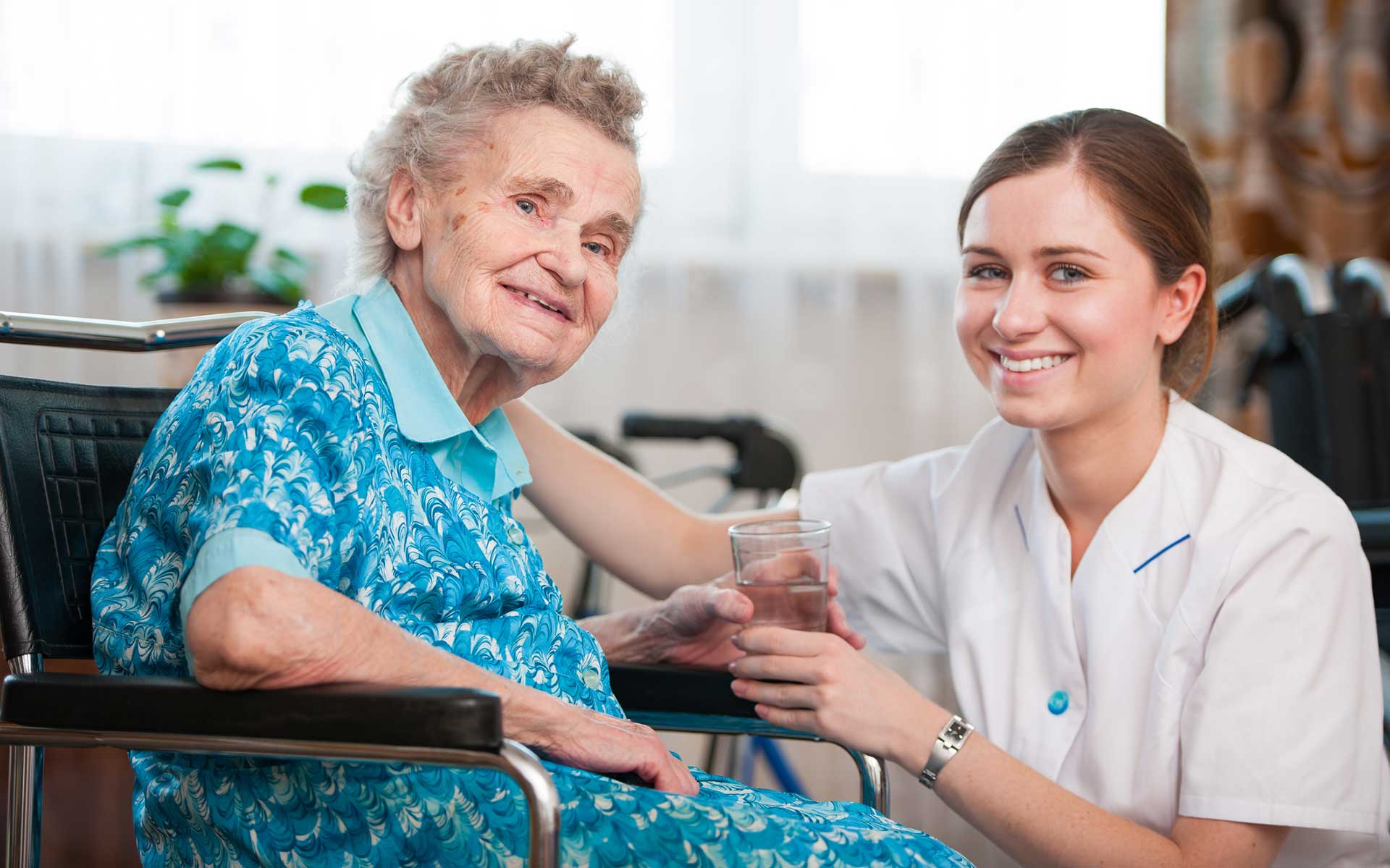 happy senior and caregiver