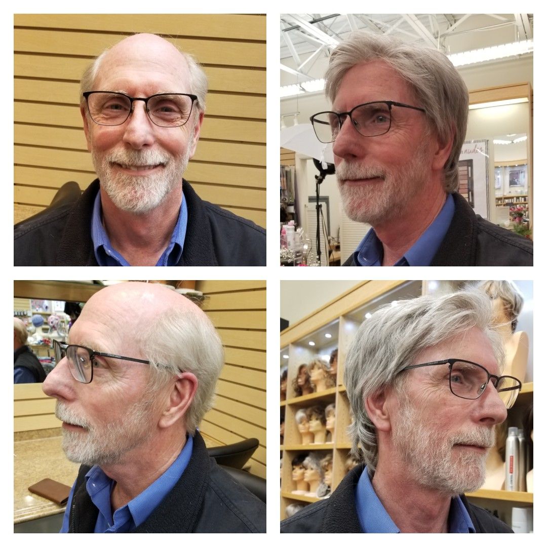 Man with dark hair and beard smiling. Fade haircut, neutral background.