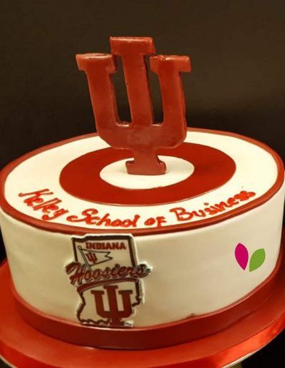 A cake that says ' kelly school of business ' on it