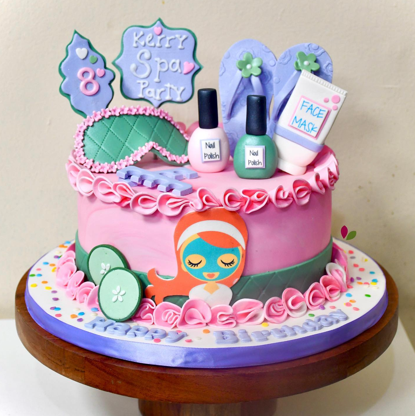 A pink and purple cake for a spa party