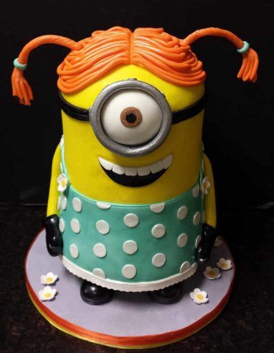 A yellow minion with orange hair and polka dot dress