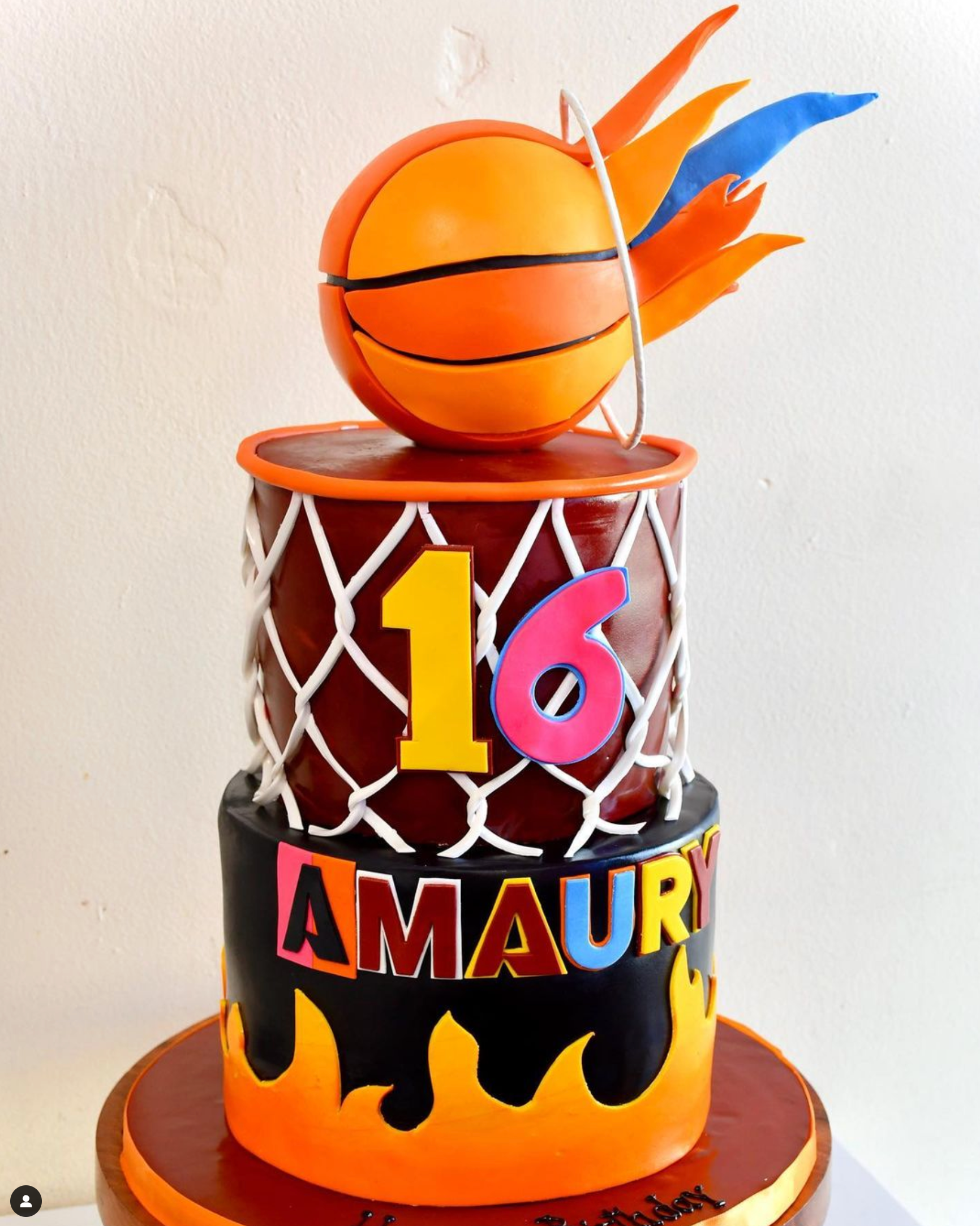 A basketball cake with the number 16 on it