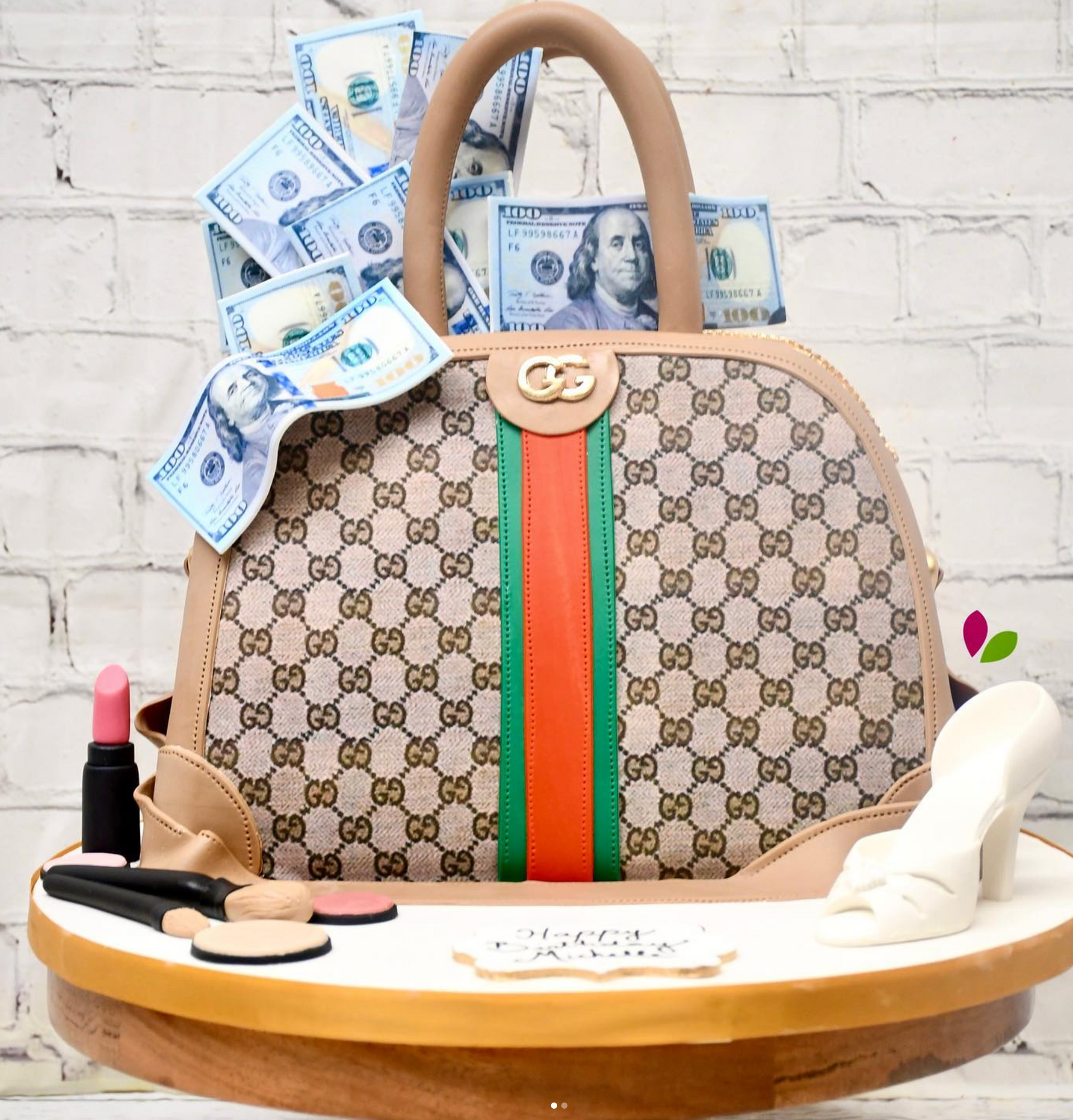 A cake with a purse and money on it