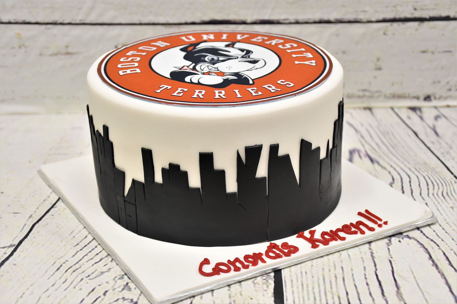 A cake that says boston terriers on it