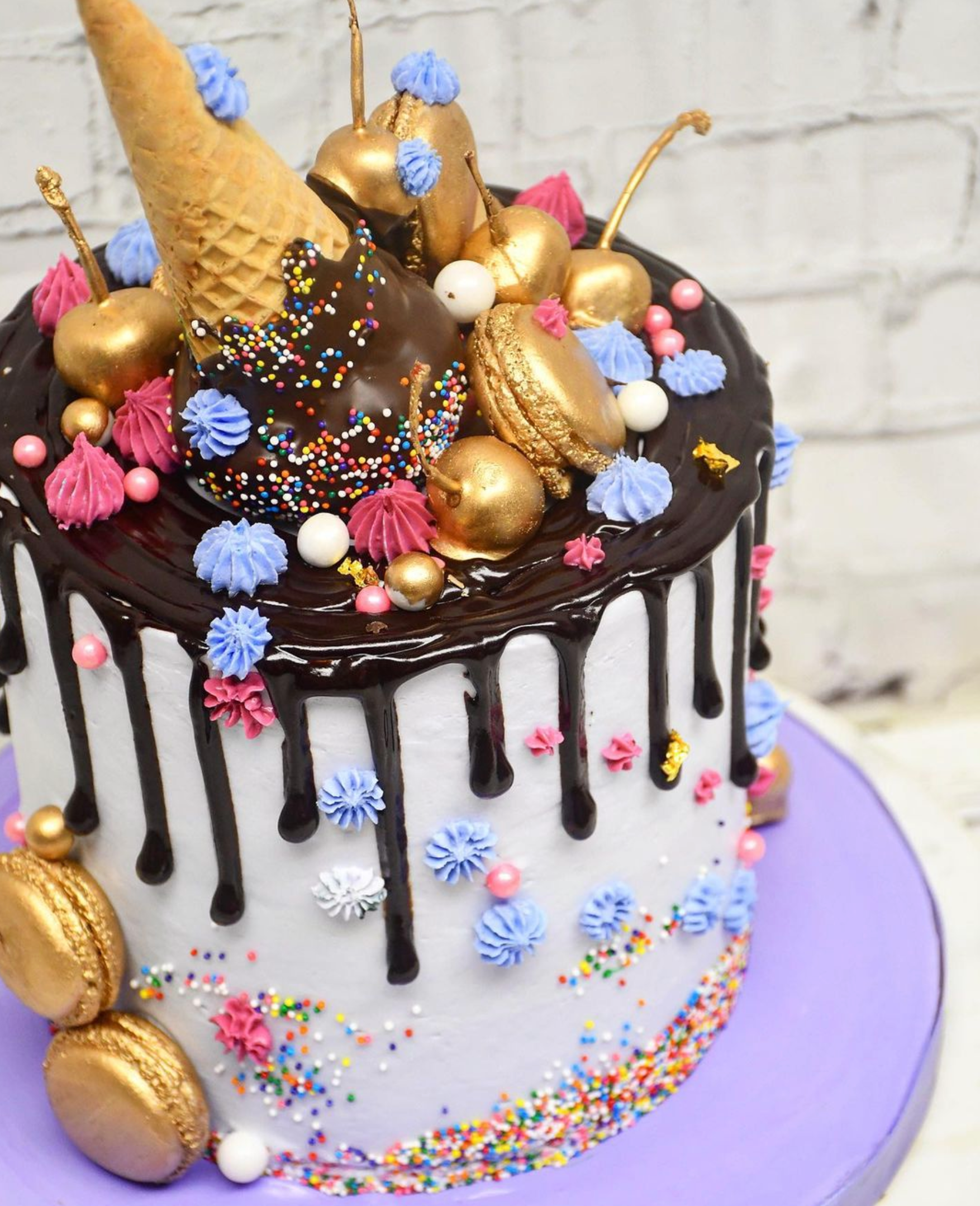 A cake with a ice cream cone on top of it