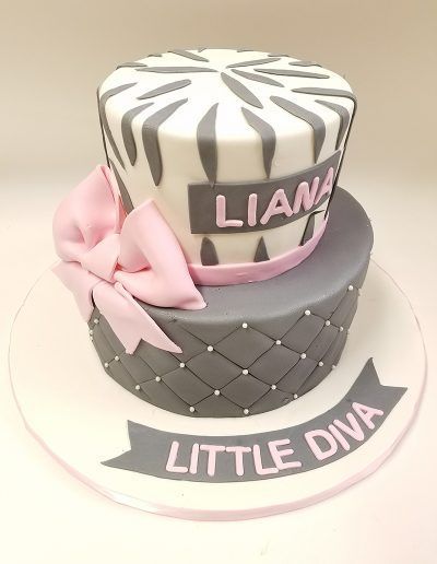 A cake that says little diva on it
