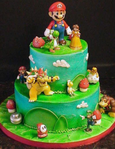 A cake with mario and bowser on top of it