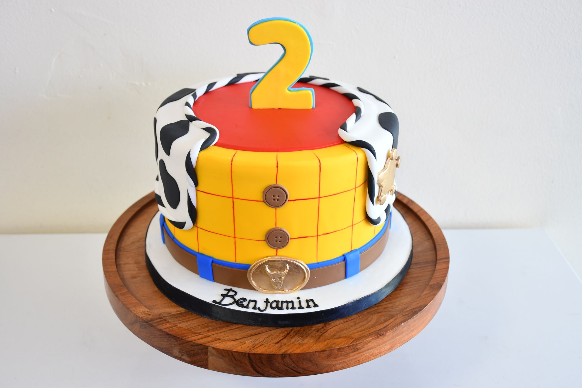 A toy story cake with the number 2 on it