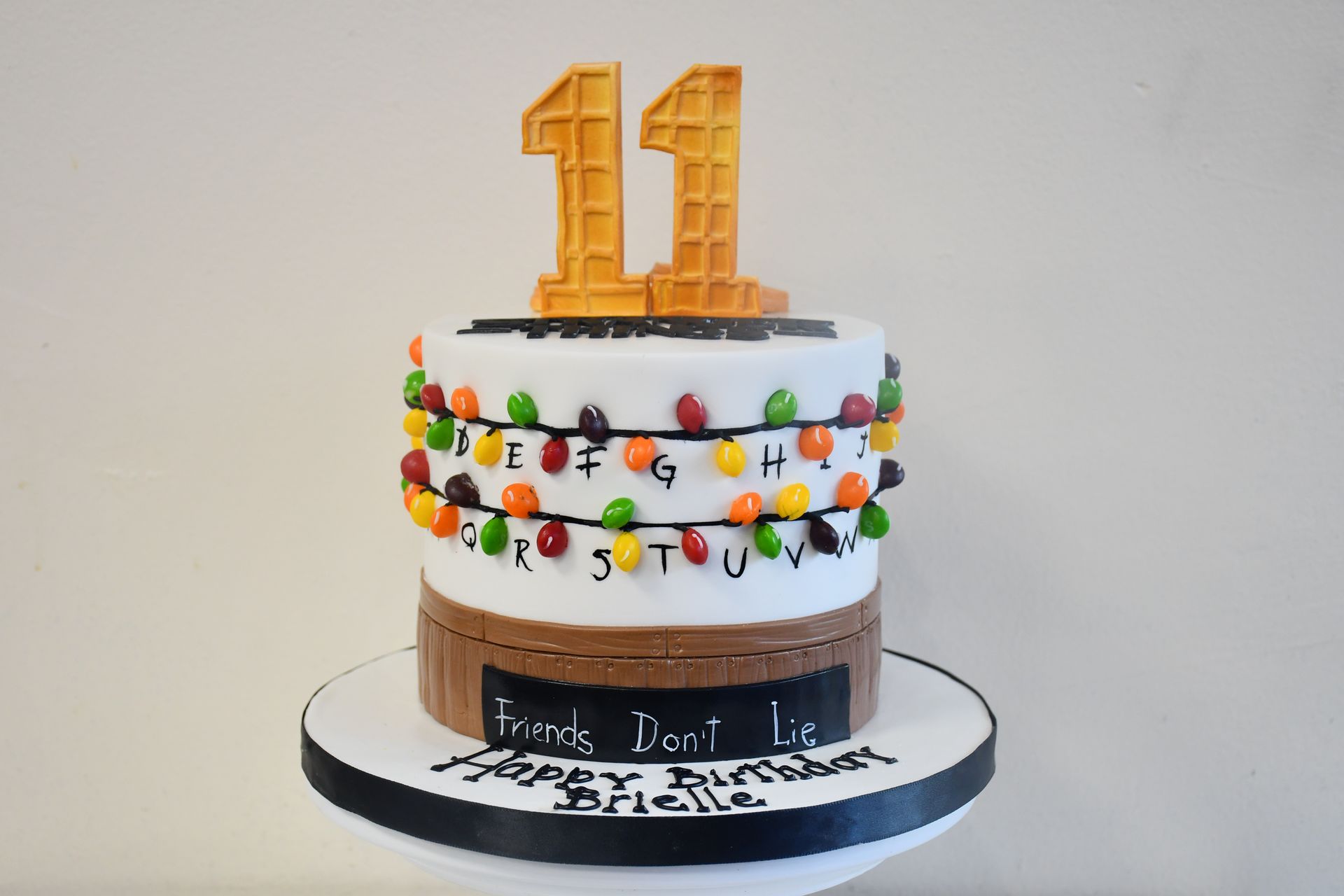 A cake with the number 11 on top of it