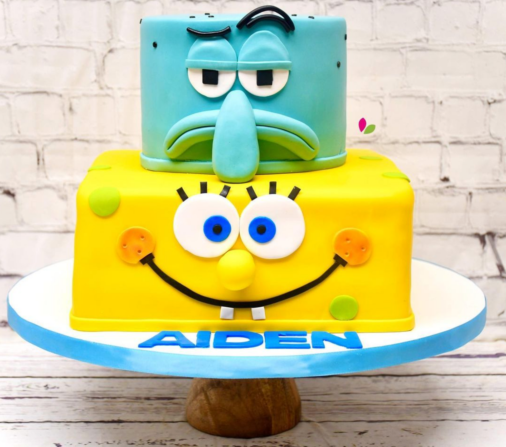A spongebob and squidward cake for aiden