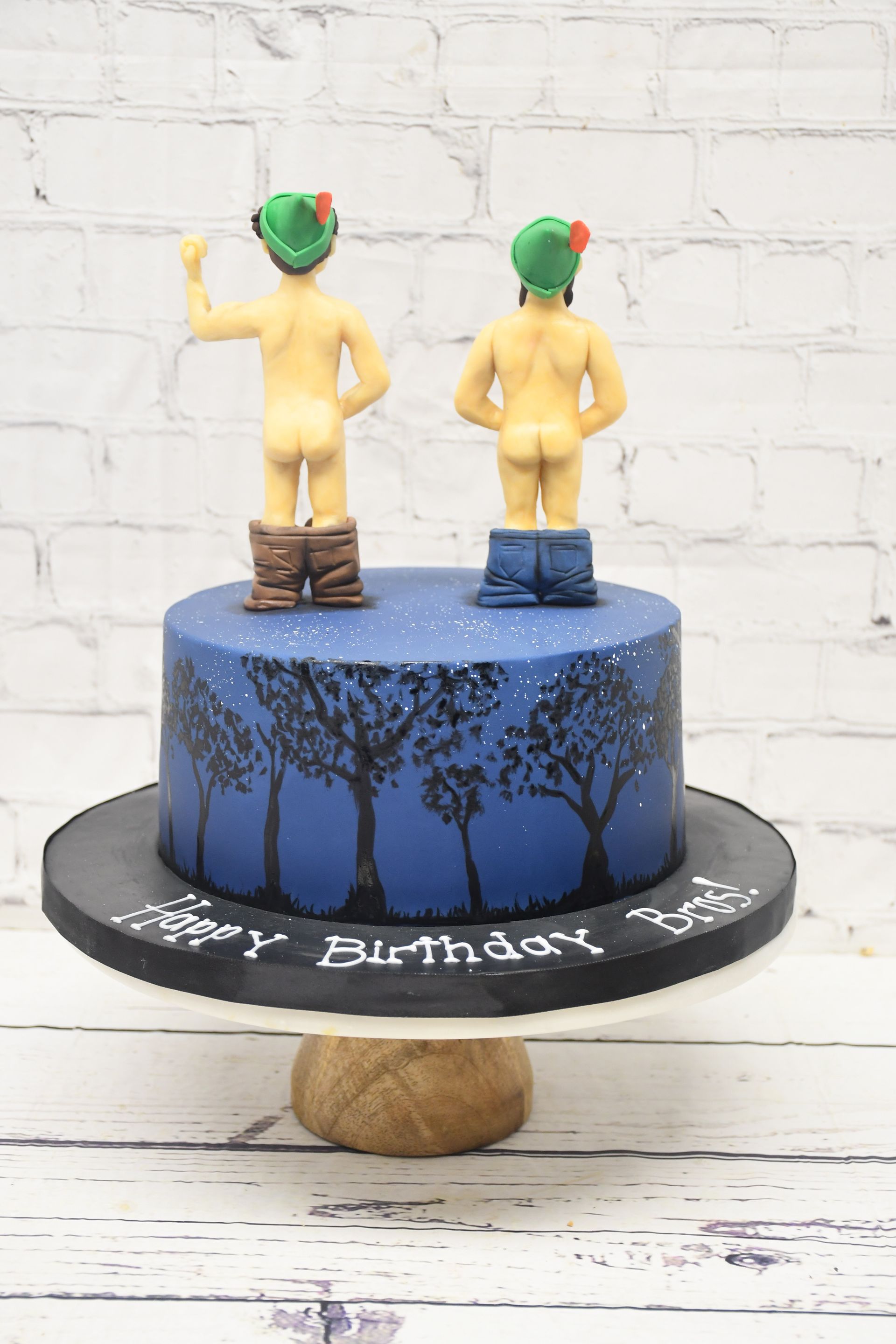 cake with two brothers on tip