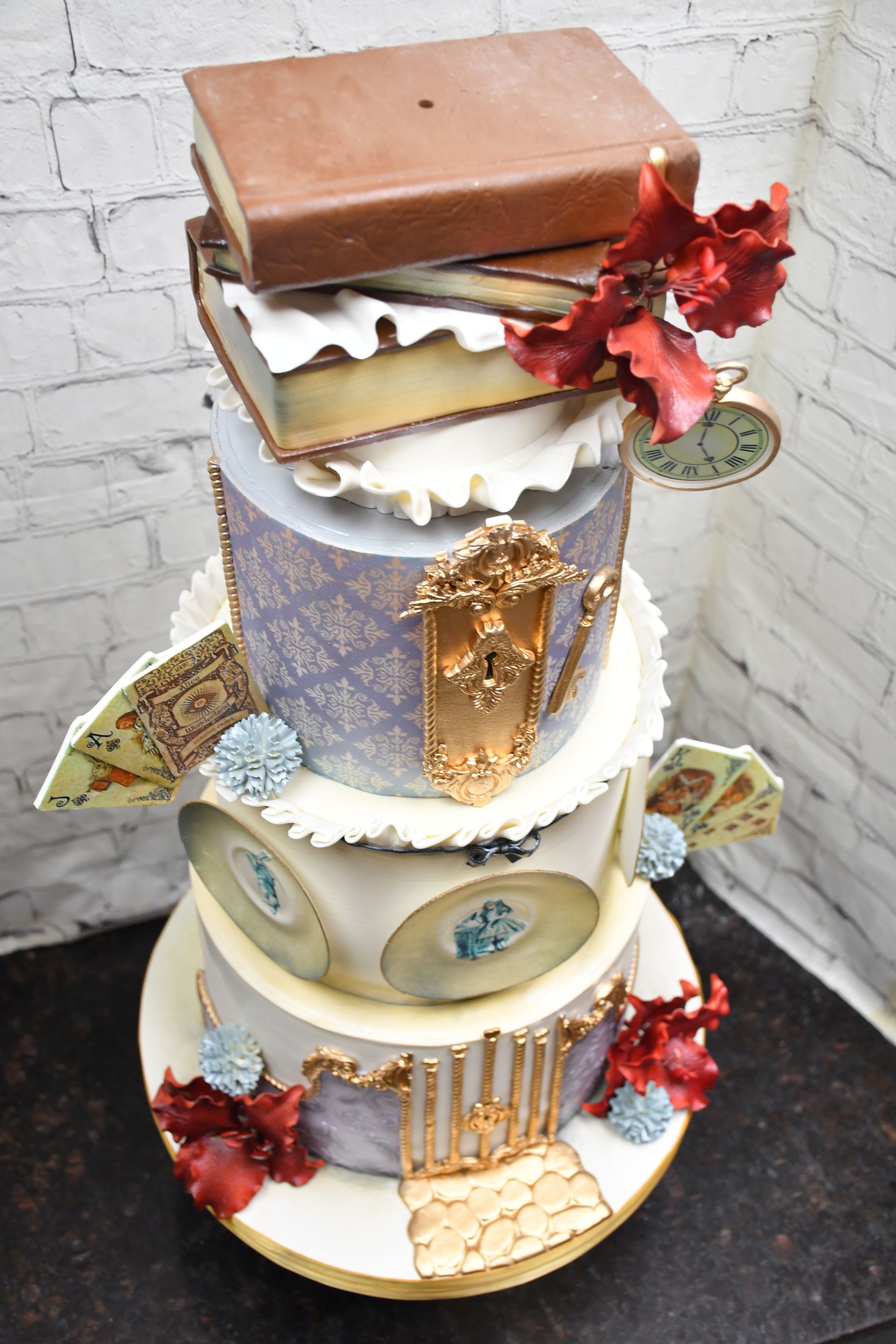 A stack of books on top of a cake