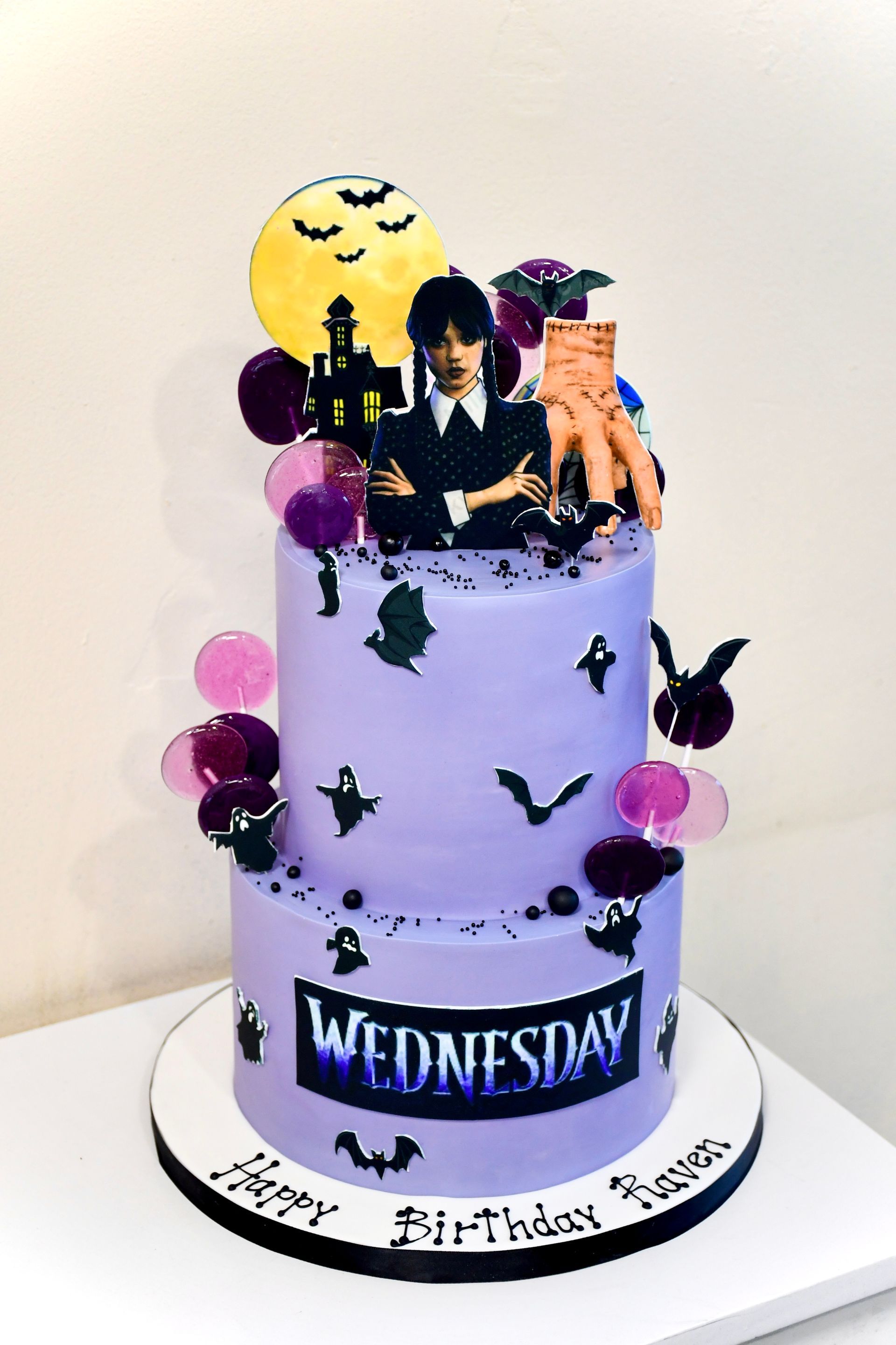 A purple birthday cake with a picture of a vampire on top.