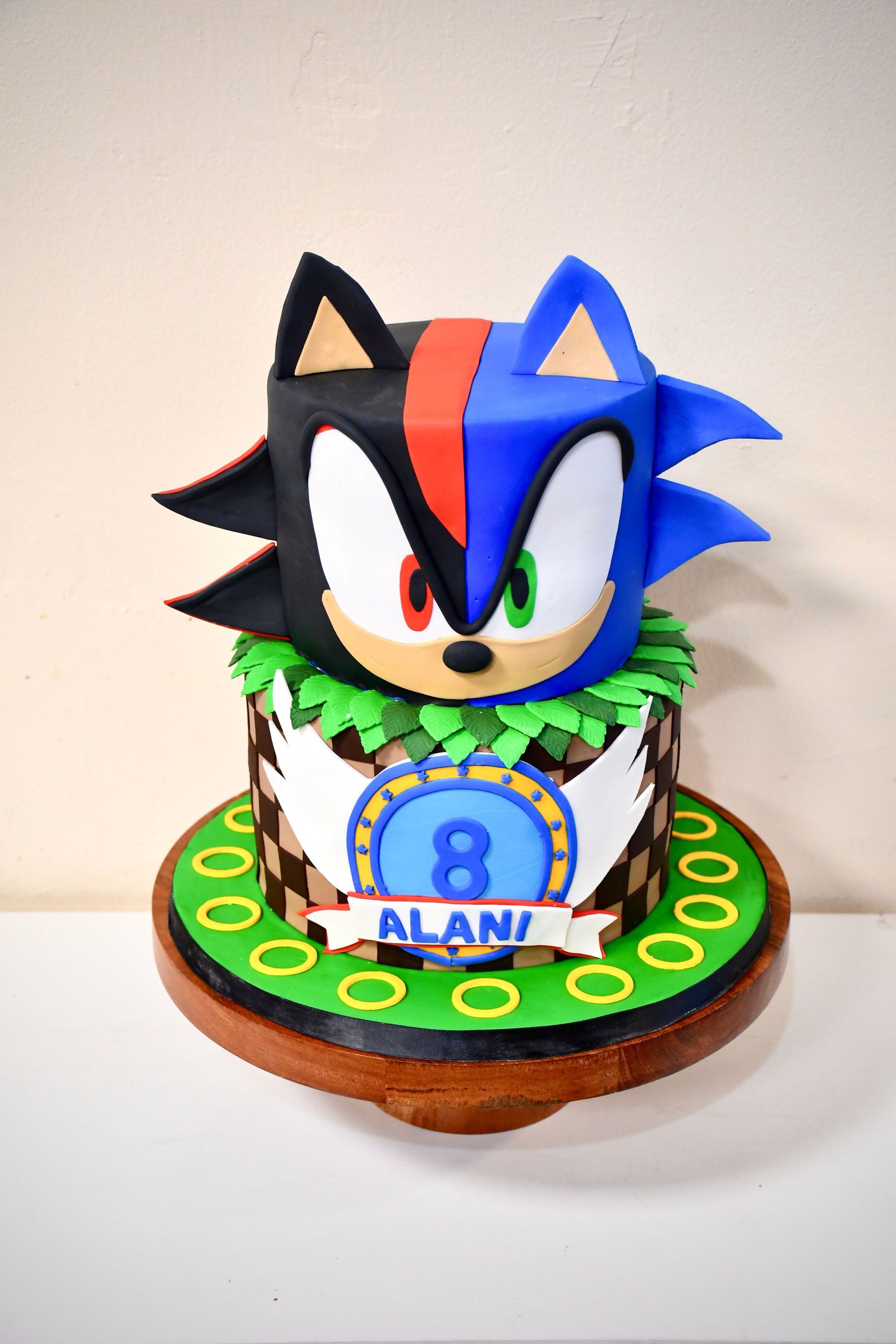 A sonic the hedgehog cake with the number 8 on it